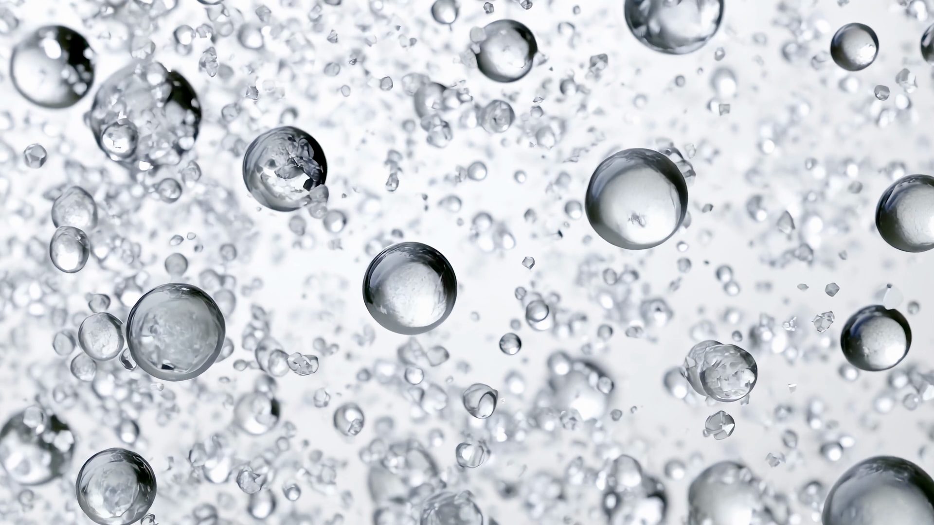 Nexus key visual: clear water droplets floating on white